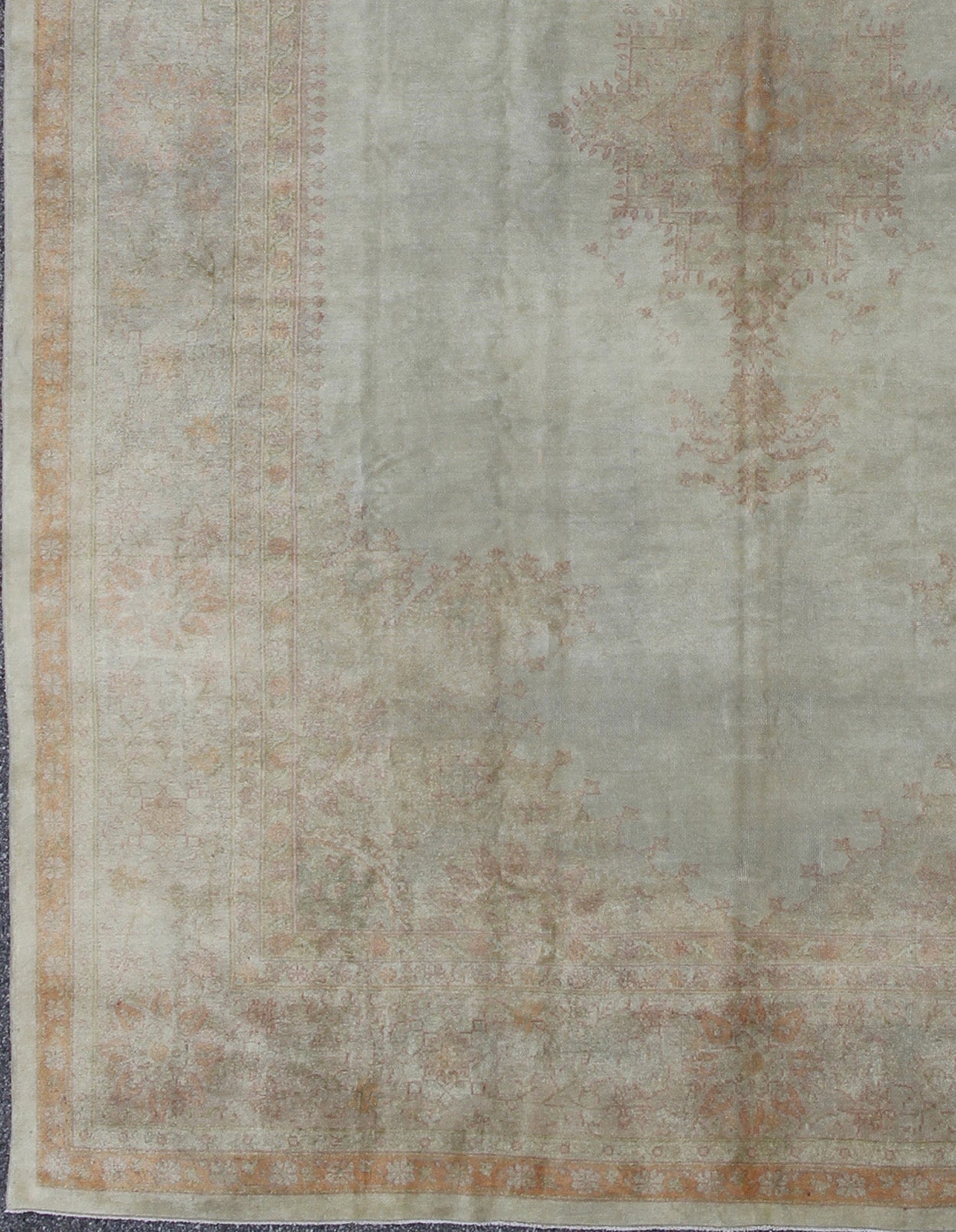 Antique Turkish Oushak This stunning antique Turkish Oushak from the late 19th Century bears a remarkably sophisticated palette of soft colors such as taupe, silver, mocha and cream. The floral designs of the border and cornices reach inward to ... - Keivan Woven ArtsG - 0703 - 1710Rug