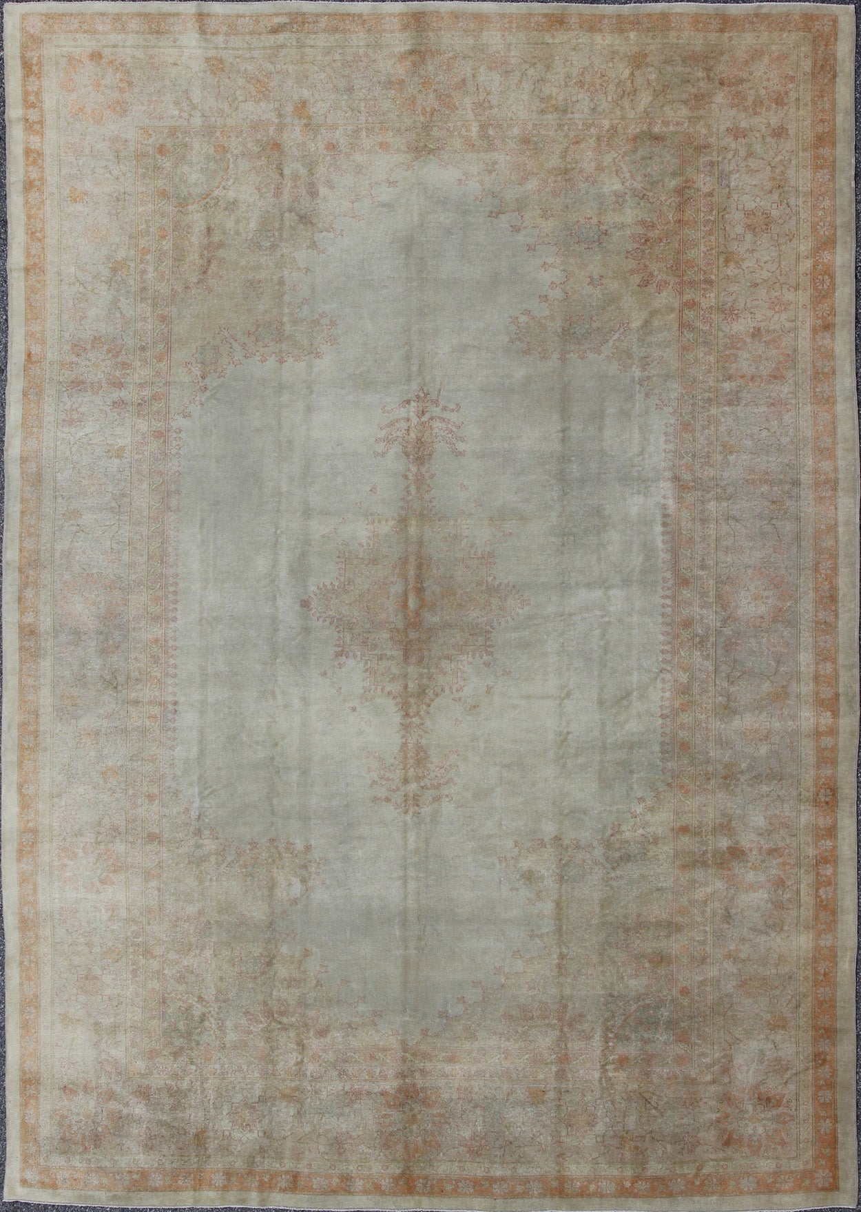 Antique Turkish Oushak This stunning antique Turkish Oushak from the late 19th Century bears a remarkably sophisticated palette of soft colors such as taupe, silver, mocha and cream. The floral designs of the border and cornices reach inward to ... - Keivan Woven ArtsG - 0703 - 1710Rug