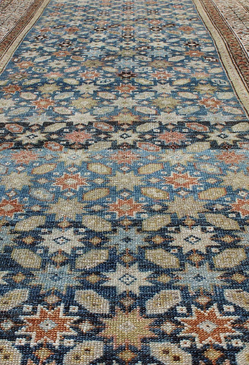 Colorful antique Persian Malayer runner with blue background, floral motifs, rug gld - 7362, country of origin / type: Iran / Malayer, circa 1910 This Persian Malayer runner from early 20th century Iran features an all - over geometric floral patter... - Keivan Woven ArtsGLD - 7362 - 9094Rug