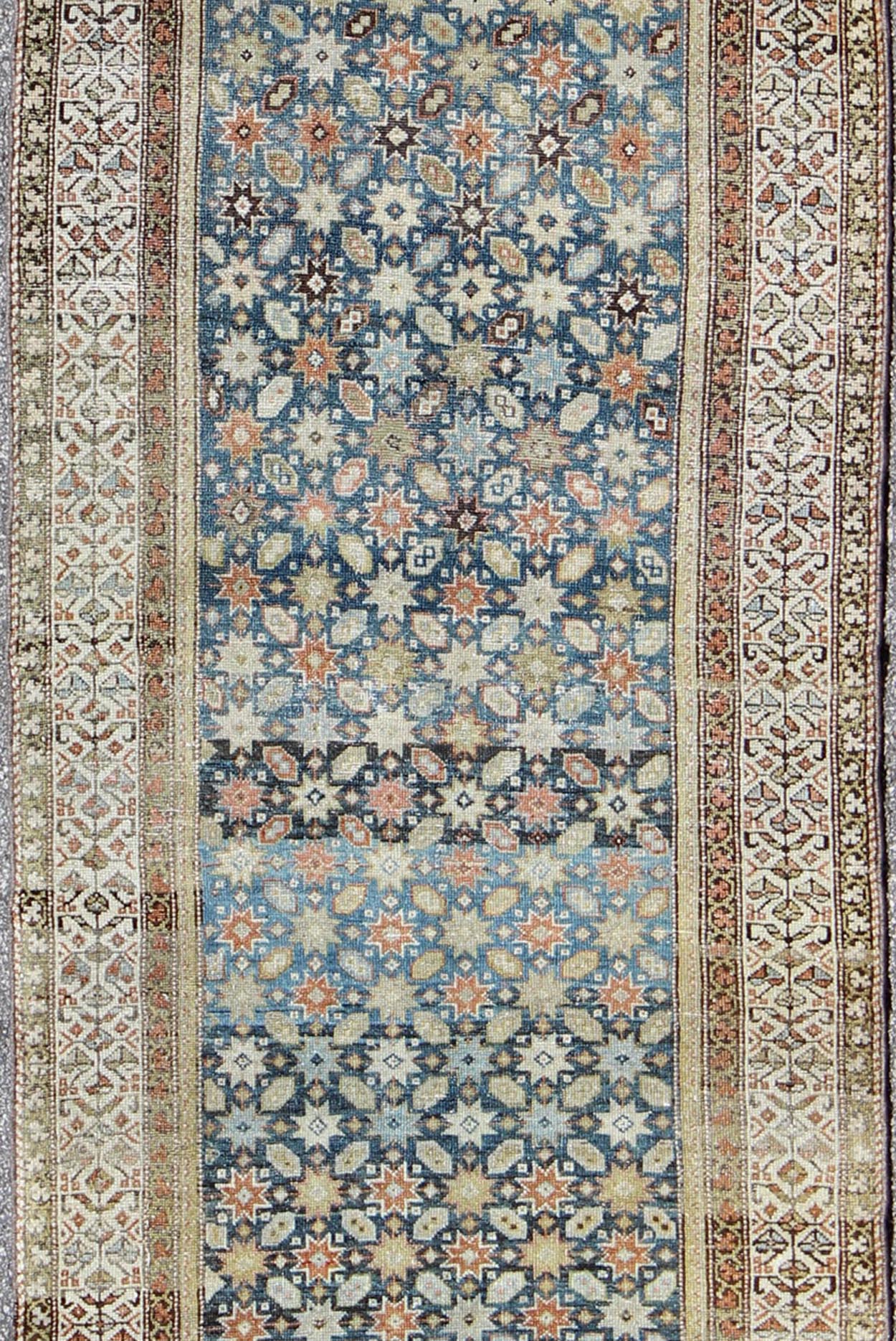 Colorful antique Persian Malayer runner with blue background, floral motifs, rug gld - 7362, country of origin / type: Iran / Malayer, circa 1910 This Persian Malayer runner from early 20th century Iran features an all - over geometric floral patter... - Keivan Woven ArtsGLD - 7362 - 9094Rug