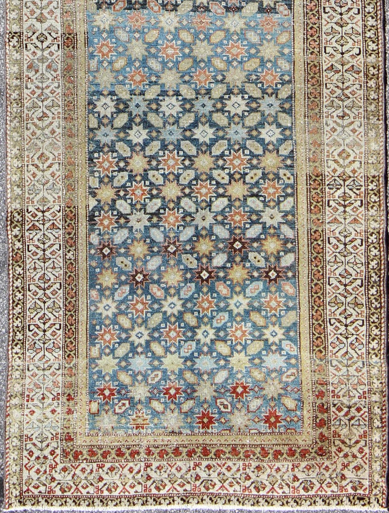 Colorful antique Persian Malayer runner with blue background, floral motifs, rug gld - 7362, country of origin / type: Iran / Malayer, circa 1910 This Persian Malayer runner from early 20th century Iran features an all - over geometric floral patter... - Keivan Woven ArtsGLD - 7362 - 9094Rug