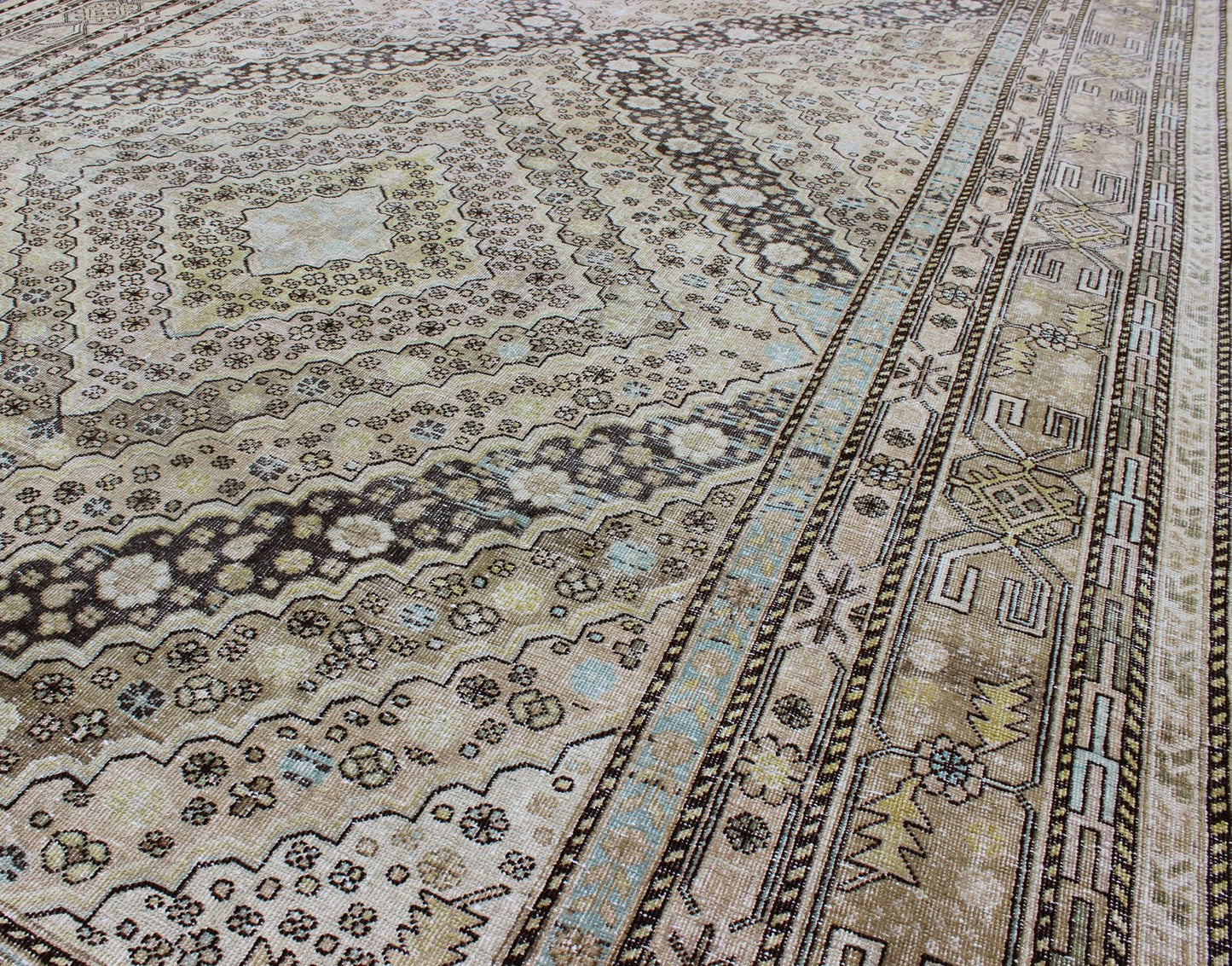 Antique Turkestanian Khotan rug with paired diamond geometric medallions, rug gld - 8495, country of origin / type: East Turkestan / Khotan, circa 1910. This delicately rendered antique Khotan rug was handcrafted in Turkestan during the early part... - Keivan Woven ArtsGLD - 8495 - 9098Rug