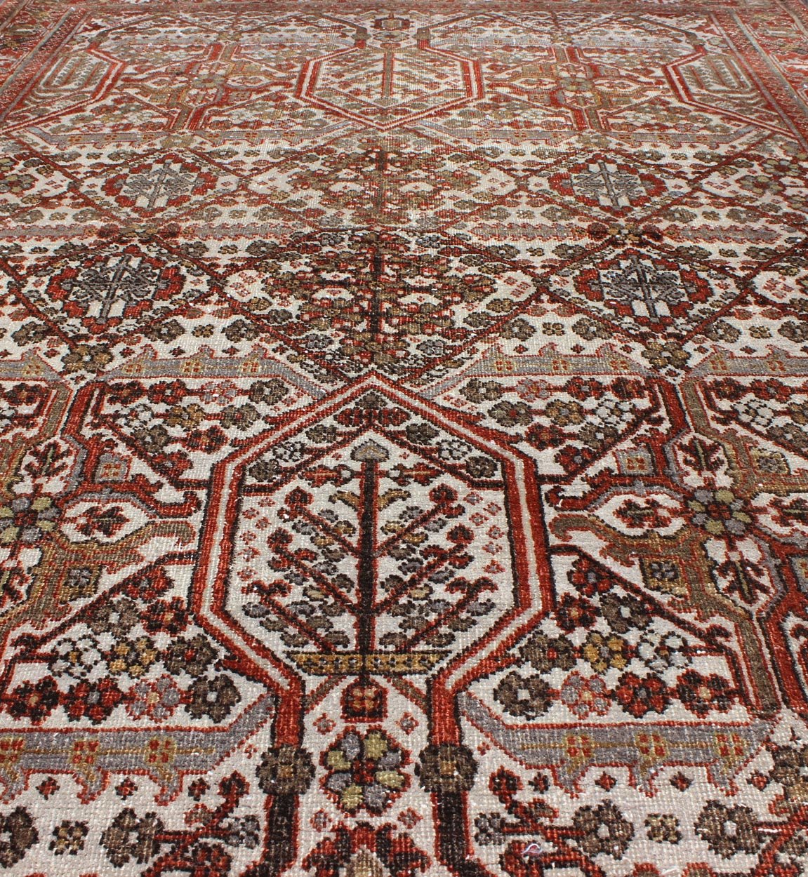 Antique Persian Joshegan Rug in Ivory Background with Red, Green and Blue This antique Joshegan rug from 1920s Iran was handwoven and bears a remarkably unique all - over interconnected Sub - geometric design, consisting mostly of diamond shapes and re... - Keivan Woven ArtsGNG - 4741 - 9898Rug