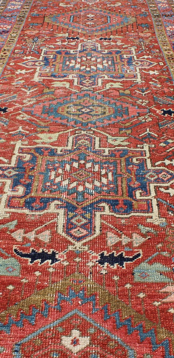 Sub - Geometric Medallion Antique Persian Heriz Runner in Red and Blue Heriz Persian antique rug with sub - geometric motifs and six medallions in colorful Tones, Keivan Woven Arts / rug gng - 4770, country of origin / type: Iran / Heriz, circa 1920 ... - Keivan Woven ArtsGNG - 4770 - 9954Rug