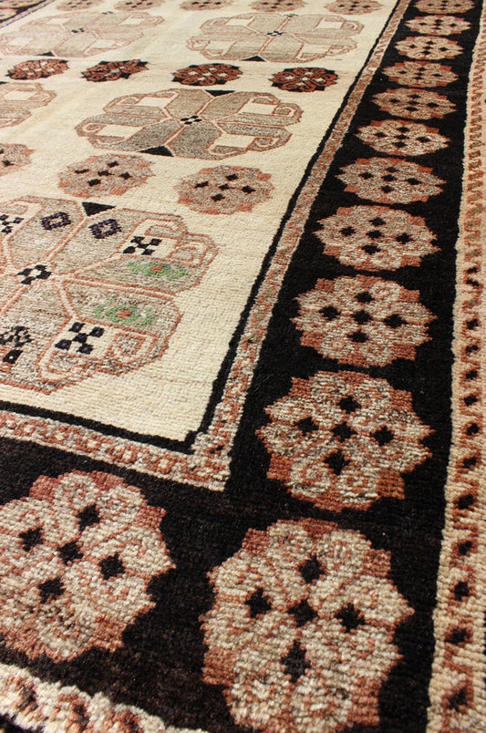 Persian Gabbeh Vintage Rug With Blossom Medallions in Brown, Ivory, Taupe, Green and Black 1950s Persian Gabbeh vintage kwarugs h - 1205 - 04, country of origin / type: Iran / Gabbeh, circa 1950 This high - pile mid - 20th century vintage Persian Gabbeh... - Keivan Woven ArtsH - 1205 - 04 - 4138