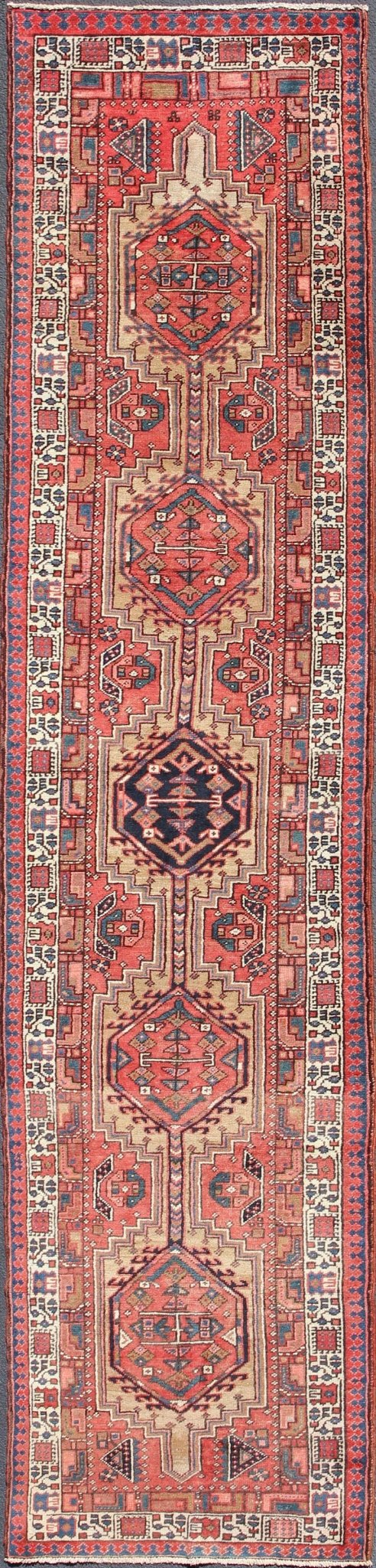 Geometric Medallion design multicolored vintage Persian Karadjeh runner, rug h - 407 - 1, country of origin / type: Iran / Karadjeh, circa 1950. This, handwoven vintage Persian Karadjeh runner features a light camel and soft red - colored field imbued... - Keivan Woven ArtsH - 407 - 1 - 1318Rug