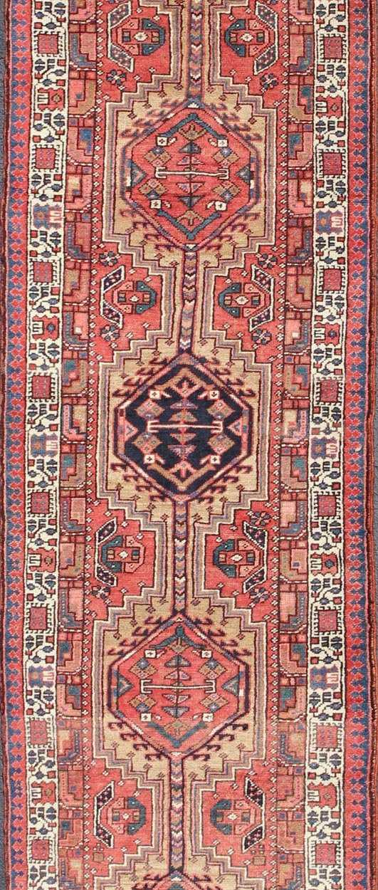 Geometric Medallion design multicolored vintage Persian Karadjeh runner, rug h - 407 - 1, country of origin / type: Iran / Karadjeh, circa 1950. This, handwoven vintage Persian Karadjeh runner features a light camel and soft red - colored field imbued... - Keivan Woven ArtsH - 407 - 1 - 1318Rug