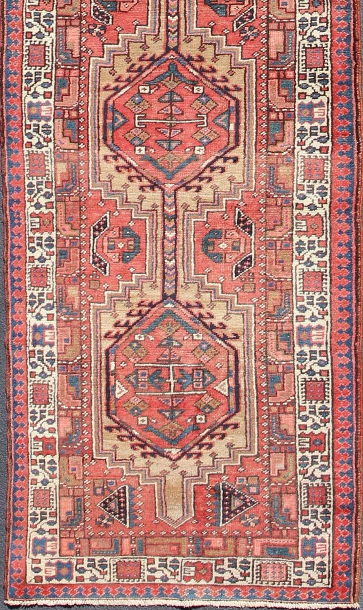 Geometric Medallion design multicolored vintage Persian Karadjeh runner, rug h - 407 - 1, country of origin / type: Iran / Karadjeh, circa 1950. This, handwoven vintage Persian Karadjeh runner features a light camel and soft red - colored field imbued... - Keivan Woven ArtsH - 407 - 1 - 1318Rug