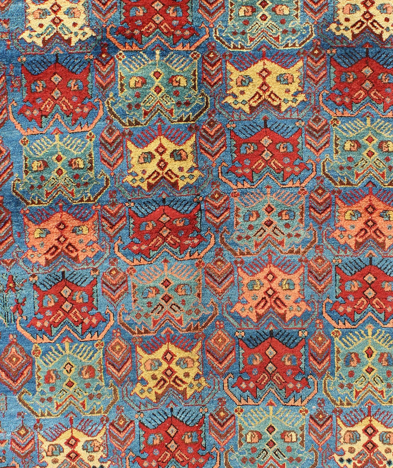 Square shape Antique Persian Afshar Rug in Blue Background, Terracotta Red Border, Light Green, vivid yellow, salmon and ivory. Bold geometry, rich symbolism, and vivid singular coloration contribute to the beauty of this stunning piece. Keivan Woven A... - Keivan Woven ArtsH8 - 1103 - 1568Rug