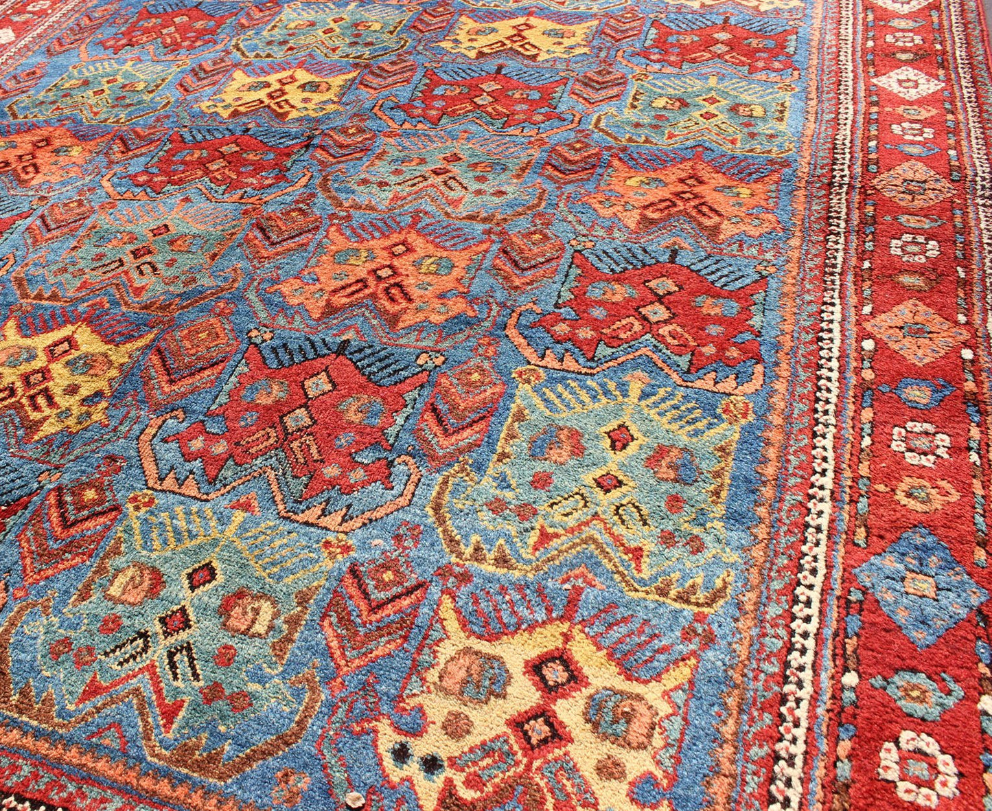 Square shape Antique Persian Afshar Rug in Blue Background, Terracotta Red Border, Light Green, vivid yellow, salmon and ivory. Bold geometry, rich symbolism, and vivid singular coloration contribute to the beauty of this stunning piece. Keivan Woven A... - Keivan Woven ArtsH8 - 1103 - 1568Rug