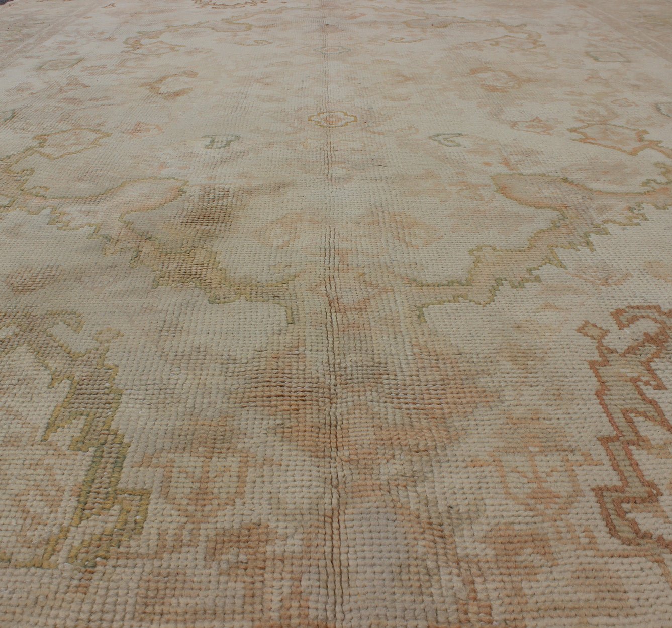 Antique Turkish Hand Knotted Oushak Rug in Taupe, Beige, Green and Copper Antique Oushak rug in taupe, beige, green copper, peach, muted brown, Keivan Woven Arts / rug / I - 1003. Antique Oushak rug Measures: 8'3 x 12'10. This antiqu... - Keivan Woven ArtsI - 1003 - 1857Rug