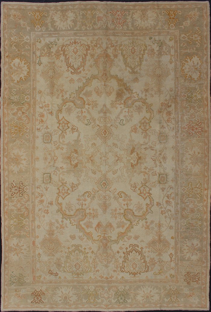 Antique Turkish Hand Knotted Oushak Rug in Taupe, Beige, Green and Copper Antique Oushak rug in taupe, beige, green copper, peach, muted brown, Keivan Woven Arts / rug / I - 1003. Antique Oushak rug Measures: 8'3 x 12'10. This antiqu... - Keivan Woven ArtsI - 1003 - 1857Rug