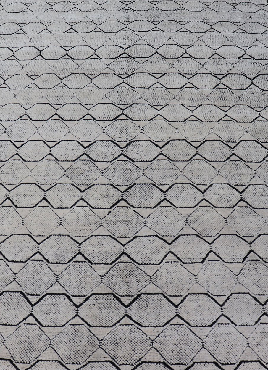 Indian Modern Geometric & Minimal Design Area Rug in Ivory and Black Measures 6'1 x 9'2 The design is a minimalistic, repeating pattern of octagons and triangles in black and ivory paneling the entire face horizontally. With a less - is - m... - Keivan Woven ArtsIN - ILM - 162 - 20988Rug