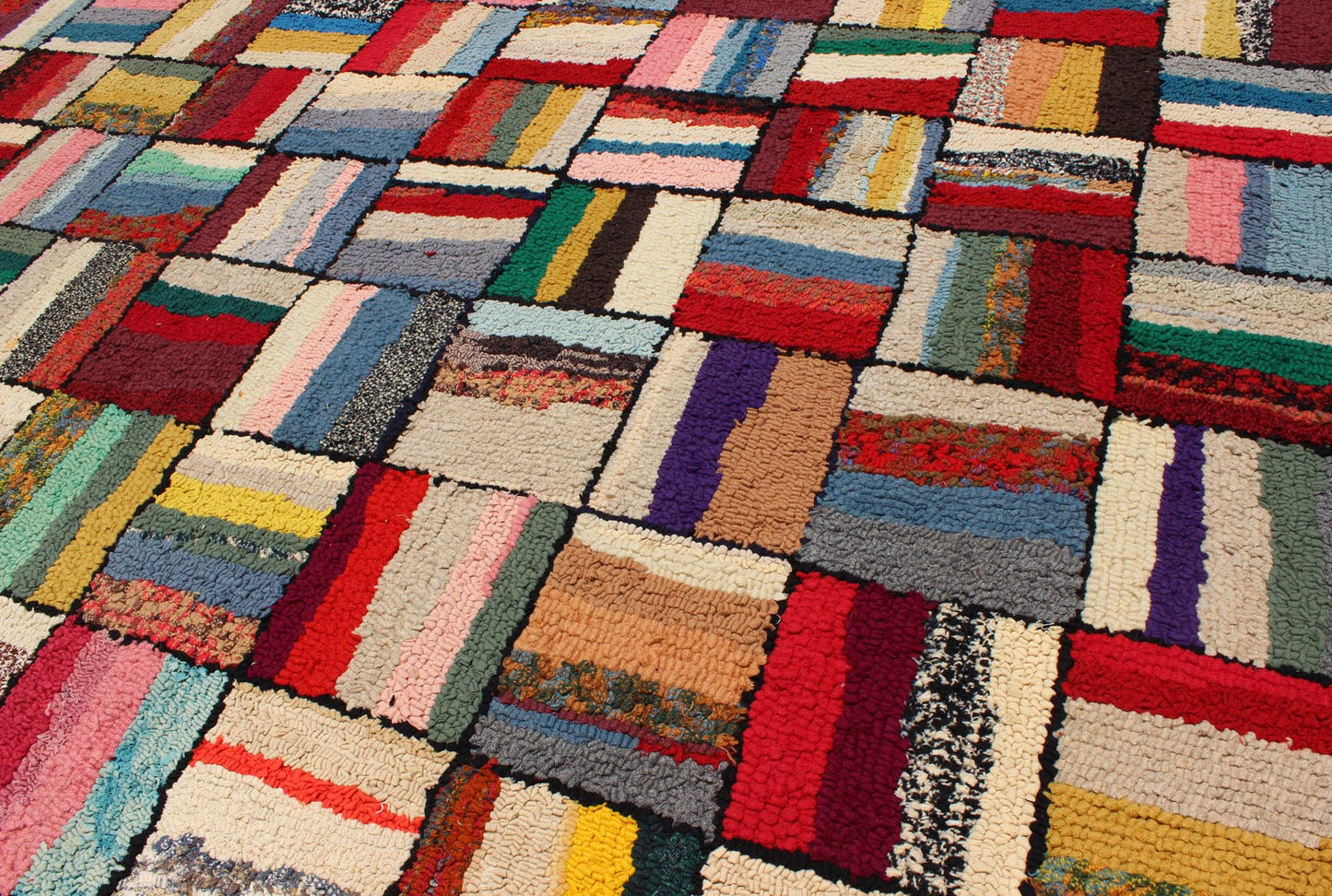 Vintage American Hook Rug This spectacular vintage American hook rug visually vibrates with a stunning myriad of colors and striped, checker - patterned weaves. The repeat patterned squares are outlined in a thin border of black and contain a vast... - Keivan Woven ArtsJ10 - 1013 - 2507Rug