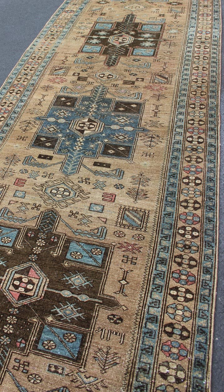 Geometric Medallion Heriz Long Antique Runner in Tan, Brown & Blue Geometric Medallion Heriz long antique runner in tan, brown and blue, rug H - 405 - 11, country of origin / type: Heriz, circa 1930. This magnificent antique Persian Heriz carpet from... - Keivan Woven ArtsKB - H - 405 - 11 - 1314Rug