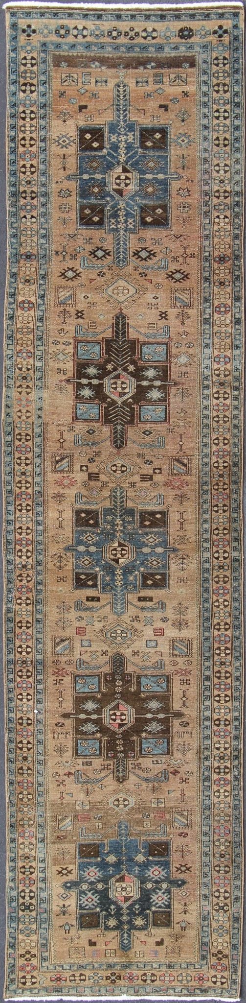 Geometric Medallion Heriz Long Antique Runner in Tan, Brown & Blue Geometric Medallion Heriz long antique runner in tan, brown and blue, rug H - 405 - 11, country of origin / type: Heriz, circa 1930. This magnificent antique Persian Heriz carpet from... - Keivan Woven ArtsKB - H - 405 - 11 - 1314Rug