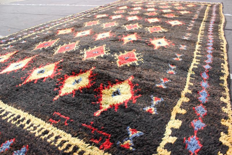 Charcoal Black Background Unique Vintage Moroccan Rug in Red and Yellow Measures: 4'9'' x 9'10''. Featuring a central charcoal field full of red and yellow diamond - shaped motifs, this unique Moroccan rug displays a harmonious and rich color p... - Keivan Woven ArtsLCB - 136610 - 7321Rug