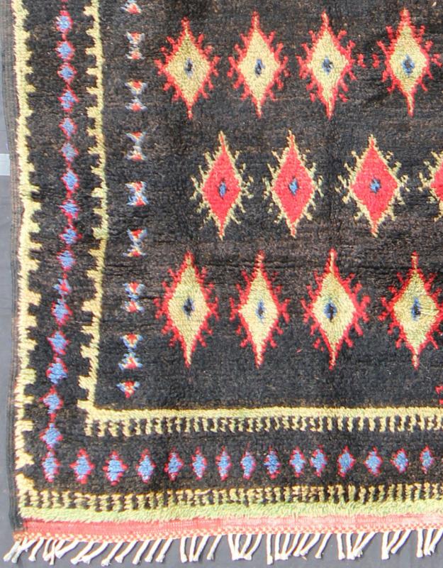 Charcoal Black Background Unique Vintage Moroccan Rug in Red and Yellow Measures: 4'9'' x 9'10''. Featuring a central charcoal field full of red and yellow diamond - shaped motifs, this unique Moroccan rug displays a harmonious and rich color p... - Keivan Woven ArtsLCB - 136610 - 7321Rug