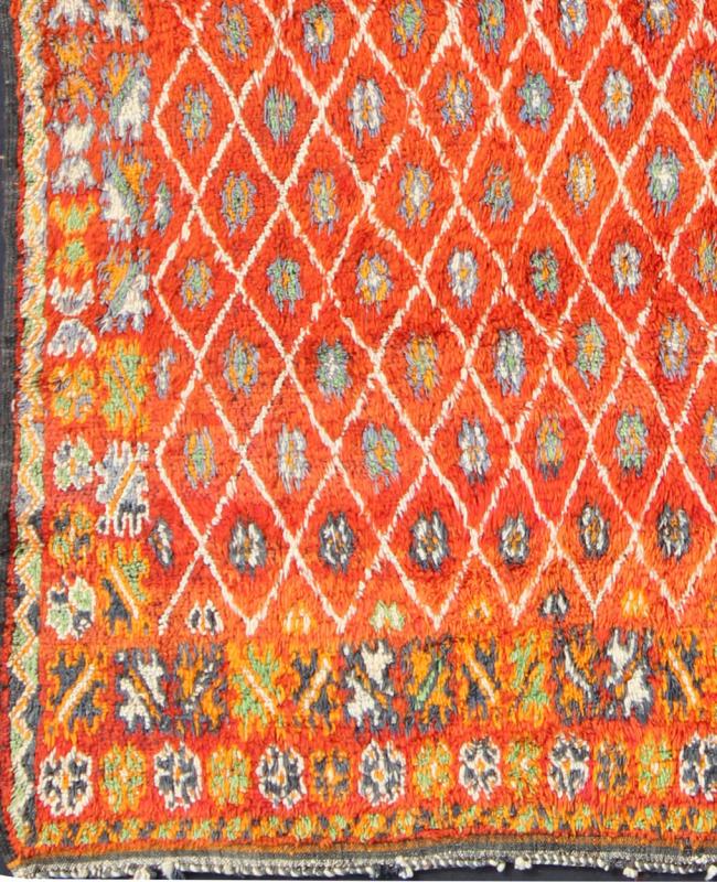 Orange and Red Background Vintage Moroccan Rug with All - Over Diamond Pattern Measures: 6'9'' x 9'0''. This Moroccan rug has an all - over diamond geometric pattern with ivory outlines, set on a field shaded with orange and red. The border featu... - Keivan Woven ArtsLCB - 136641 - 7333Rug