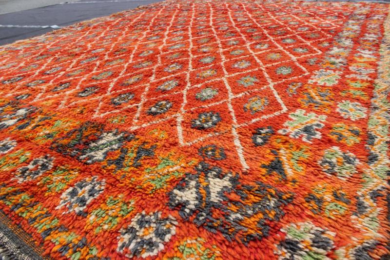 Orange and Red Background Vintage Moroccan Rug with All - Over Diamond Pattern Measures: 6'9'' x 9'0''. This Moroccan rug has an all - over diamond geometric pattern with ivory outlines, set on a field shaded with orange and red. The border featu... - Keivan Woven ArtsLCB - 136641 - 7333Rug