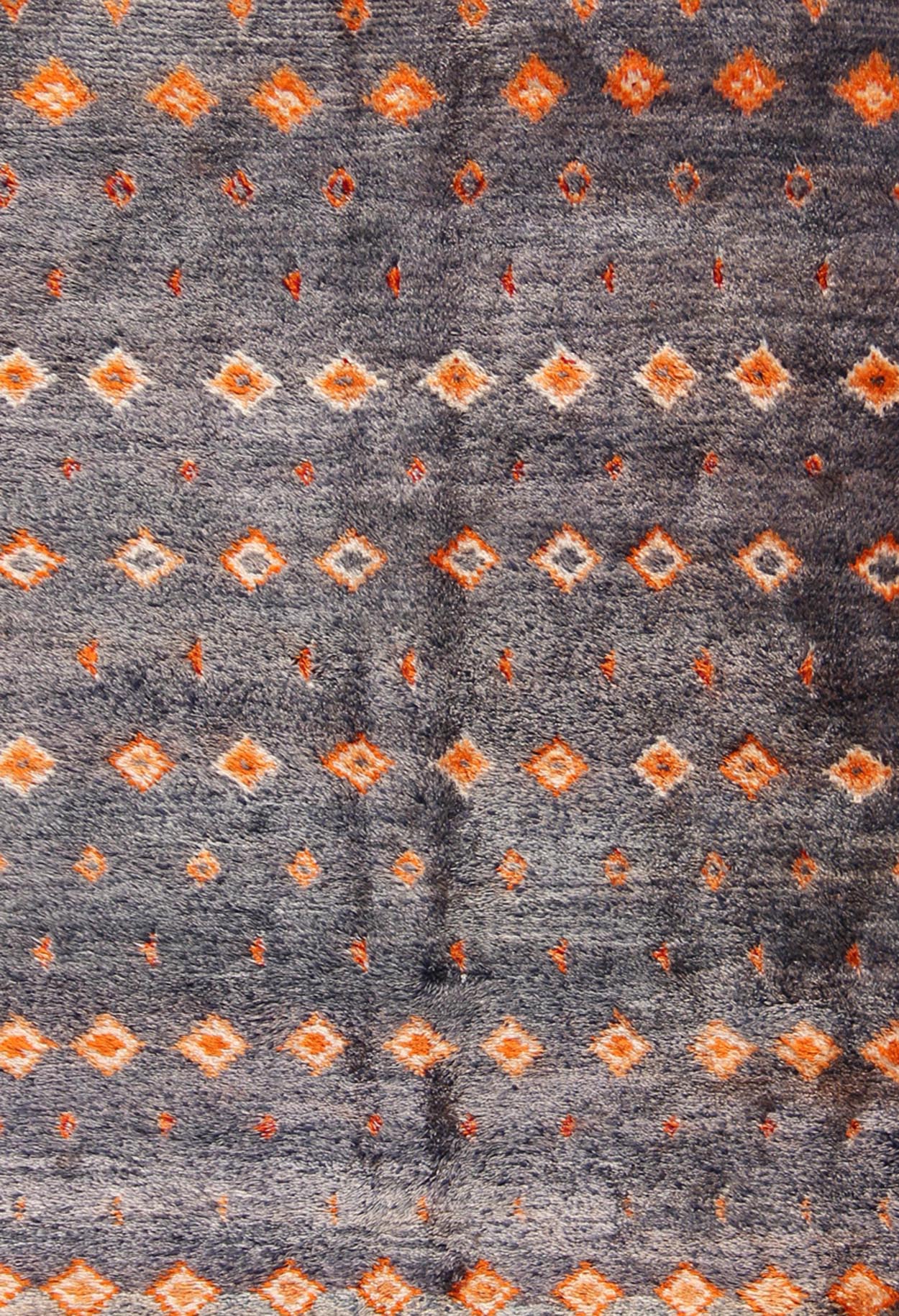 Charcoal and Orange Vintage Moroccan Rug with Geometric Design Moroccan Vintage Rug with Orange Geometric Design Rendered on a Variegated Charcoal Field, rug lcb - 18 - 79, country of origin / type: Morocco / Tribal, circa 1940. Crafted in t... - Keivan Woven ArtsLCB - 18 - 79 - 9587Rug