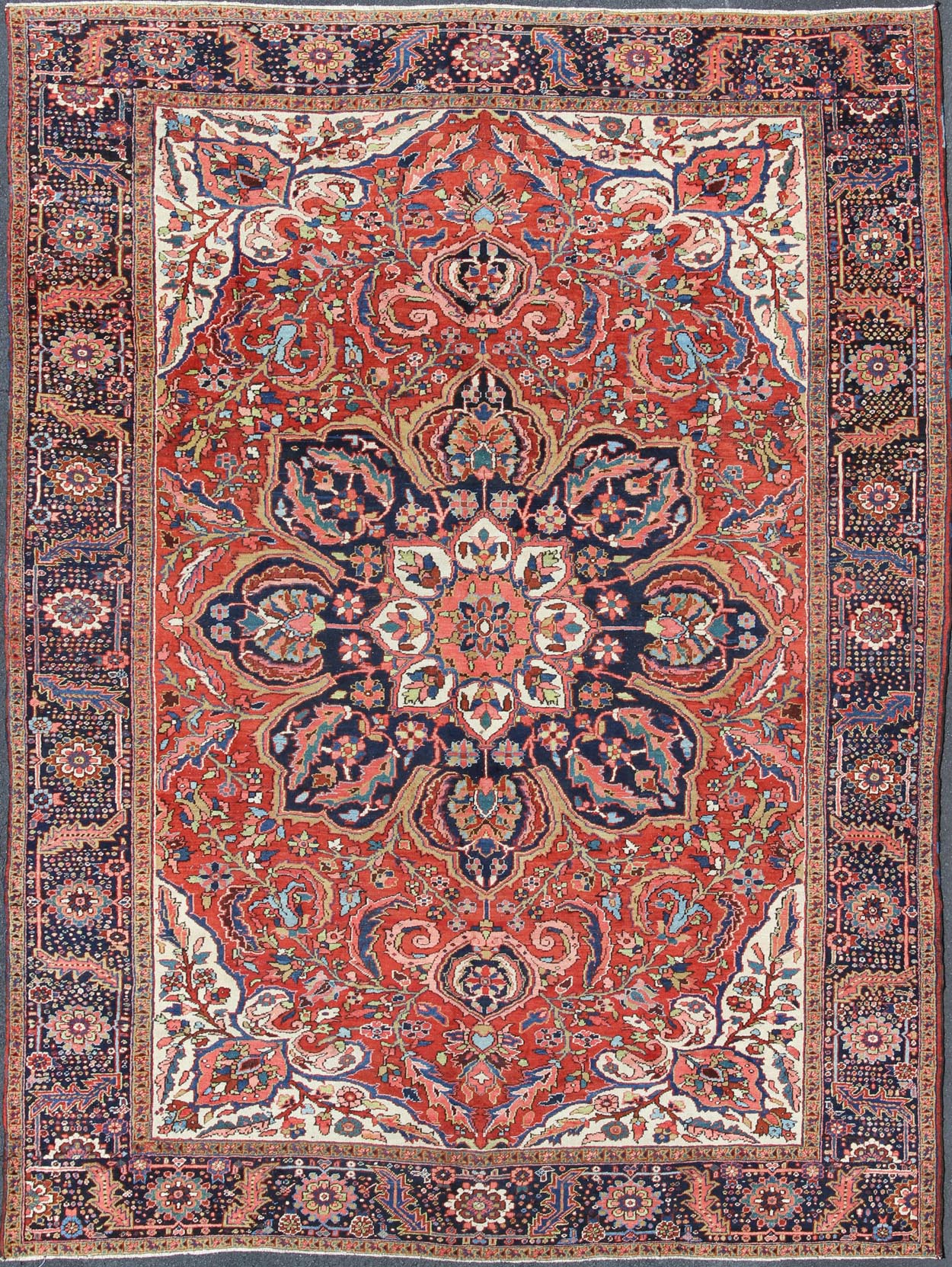Large Persian Heriz Rug with Geometric Medallion in Rust, Pink, Green and Blue. Keivan Woven Arts / Rug / M14 - 0501, country of origin / type: Iran /Heriz, circa 1930. Measures: 10'1 x 13'5. Masterful craftsmanship and a strong tribal design make... - Keivan Woven ArtsM14 - 0501 - 5371Rug