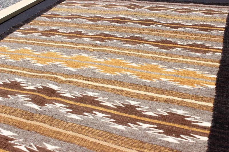 Earthy Tones USA Navajo Kilim rug with Black Border Tribal Design 1940s Navajo Tribal Kilim with geometric design in Marigold, grey and black rug M14 - 0902, country of origin / type: America / Navajo, circa 1940 This intriguing antique Nav... - Keivan Woven ArtsM14 - 0902 - 5930Rug