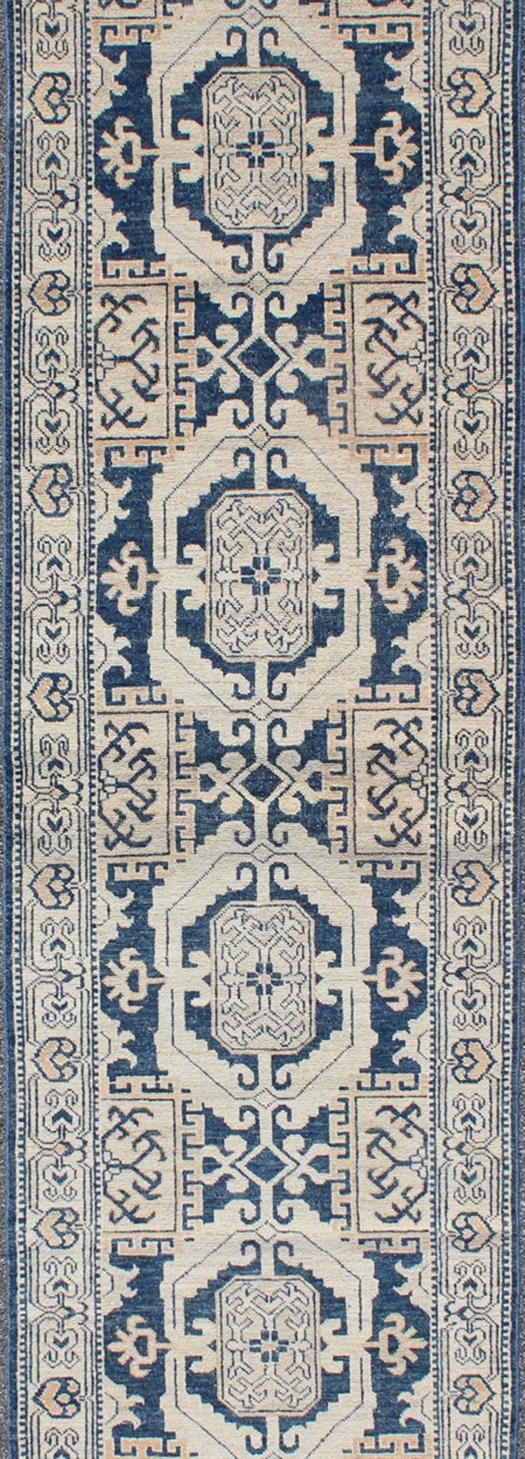 Vintage Khotan Rug with Geometric Medallions in Navy and Cream Tones Khotan with Geometric Medallions, rug MP - 1310 - 93, country of origin / type: Afghanistan / Khotan, circa Early - 21st Century. Measures: 2'11 x 10'3. This Khotan fe... - Keivan Woven ArtsMP - 1310 - 93 - 4758Rug