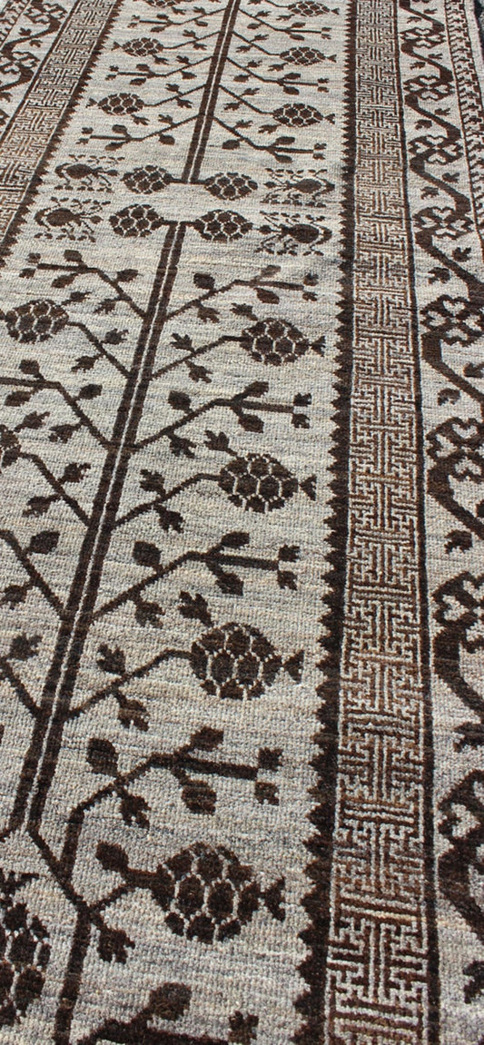 Rug with Geometric Medallions Khotan with Geometric rug MP - 1404 - 909, country of origin / type: Afghanistan / Khotan This Reproduction Khotan features a geometric multi - medallion pomegranate design flanked by a repeating pattern in the field.... - Keivan Woven ArtsMP - 1404 - 909 - 5367