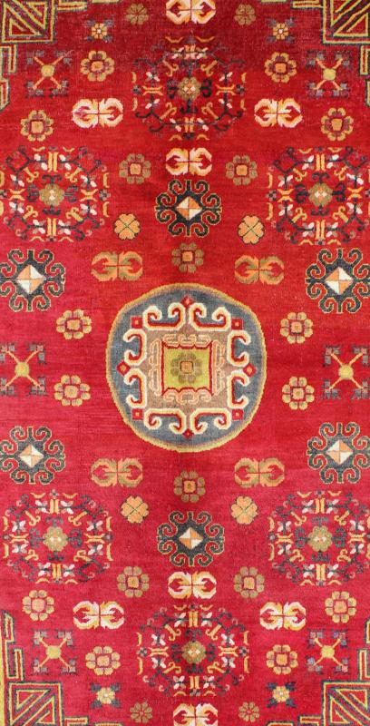 Red Antique Khotan Rug in Rich Red, Charcoal and green colors This attractive vintage Khotan rug is a spectacular testament to the complexity of Turkestan design. The red of the central field plays host to a stunning display of the entwined tree... - Keivan Woven ArtsMP - 1610 - 157285 - 7873Rug