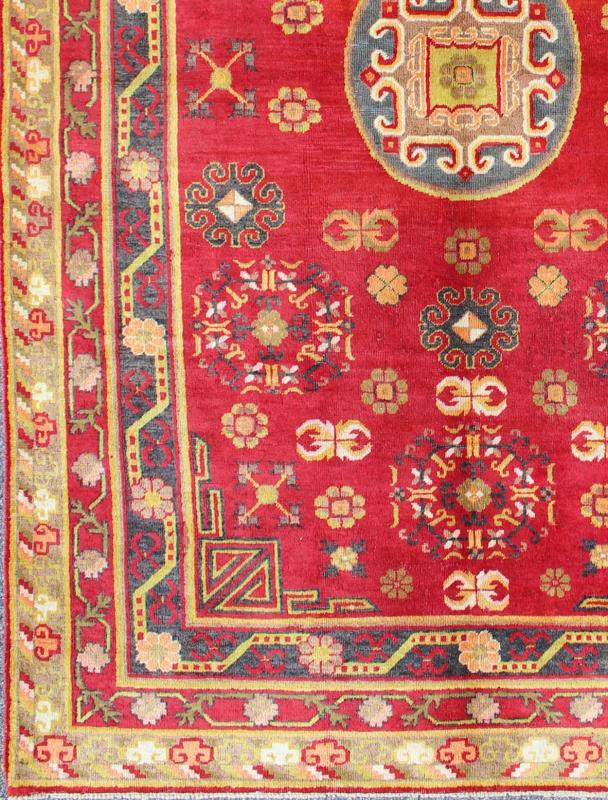 Red Antique Khotan Rug in Rich Red, Charcoal and green colors This attractive vintage Khotan rug is a spectacular testament to the complexity of Turkestan design. The red of the central field plays host to a stunning display of the entwined tree... - Keivan Woven ArtsMP - 1610 - 157285 - 7873Rug