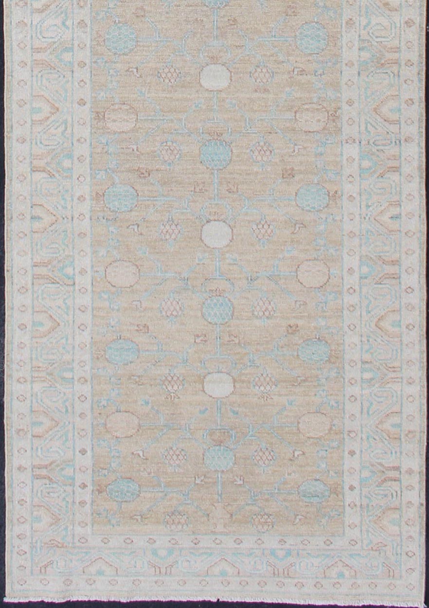 Pomegranate Khotan Design Long Runner in Soft Gold & L. Blue & Geometric Border. Long Khotan runner in Pomegranate Khotan Design, rug MP - 1910 - 10524, country of origin / type: Afghanistan / Khotan This Khotan features a geometric all - over Pom... - Keivan Woven ArtsMP - 1910 - 10524 - 12222Rug