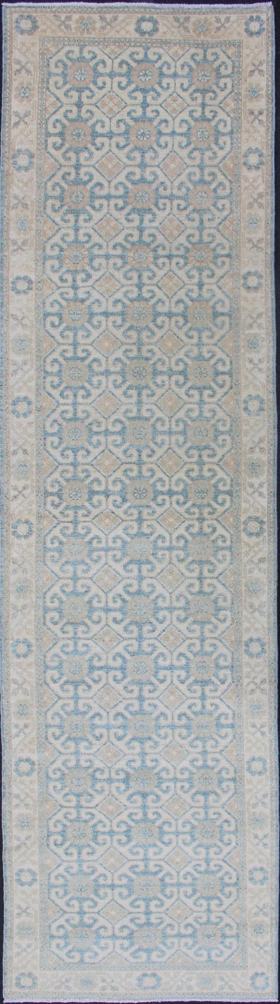 Rug with All - over Khotan Design with Geometric Motifs MP - 1911 - 10702, country of origin / type: Afghanistan / Khotan This Reproduction Khotan features a geometric all - over design flanked by a repeating pattern in the border. The entirety of the p... - Keivan Woven ArtsMP - 1911 - 10702 - 12557Rug