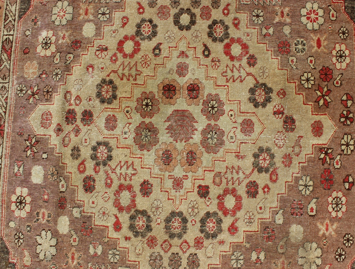 Antique Khotan Medallion Rug in Neutrals and Blush with Floral Motifs All - Over Measures: 6'4 x 11'6 This beautiful Khotan rug, from early 20th century Turkestan features layered medallions in geometric and diamond shapes. The field and ... - Keivan Woven ArtsMP - 252 - 2125Rug