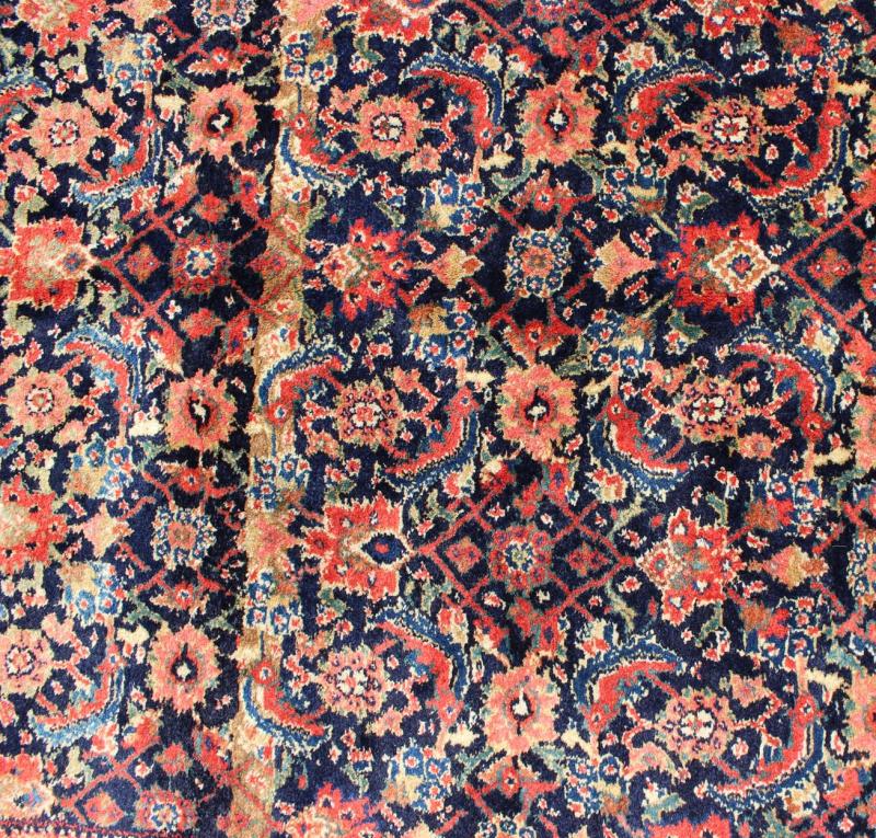 Antique Persian Gallery Bidjar Rug This piece is a Northwest Persian Bidjar carpet with a navy field decorated by red lattice - work and various flowers in shades of coral, sky blue, green, light camel, mahogany, ivory and red. Ivory and sky blue ... - Keivan Woven ArtsN15 - 0201 - 76Rug