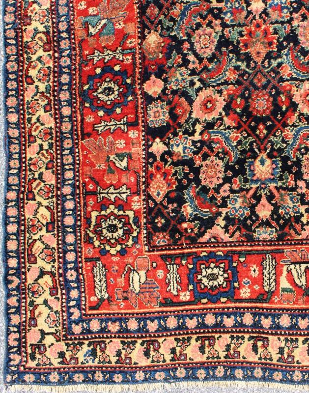 Antique Persian Gallery Bidjar Rug This piece is a Northwest Persian Bidjar carpet with a navy field decorated by red lattice - work and various flowers in shades of coral, sky blue, green, light camel, mahogany, ivory and red. Ivory and sky blue ... - Keivan Woven ArtsN15 - 0201 - 76Rug
