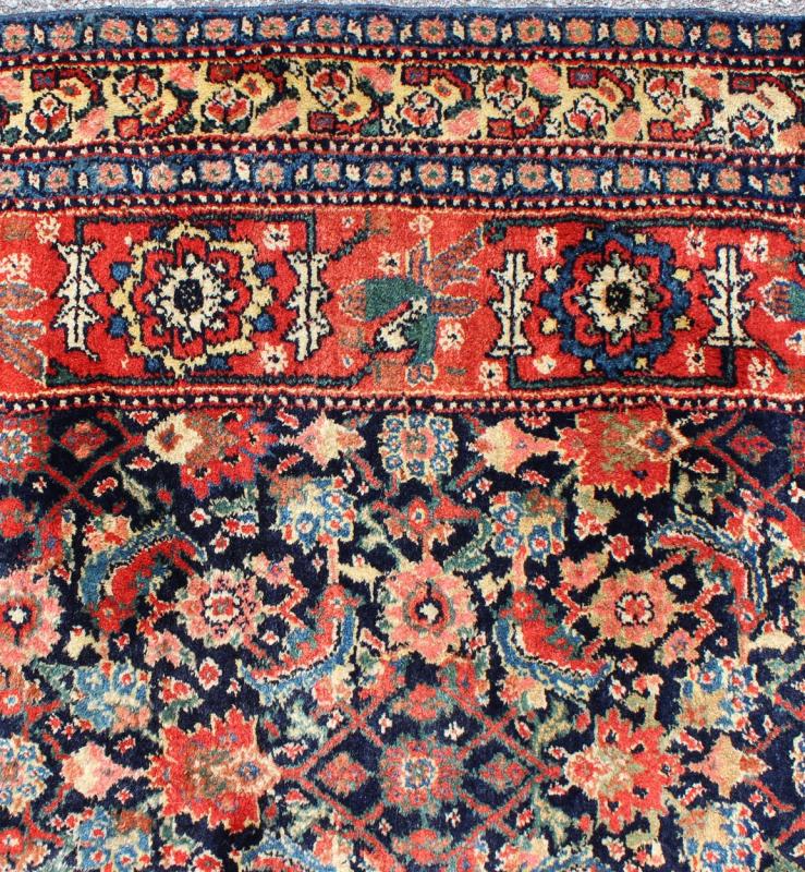 Antique Persian Gallery Bidjar Rug This piece is a Northwest Persian Bidjar carpet with a navy field decorated by red lattice - work and various flowers in shades of coral, sky blue, green, light camel, mahogany, ivory and red. Ivory and sky blue ... - Keivan Woven ArtsN15 - 0201 - 76Rug