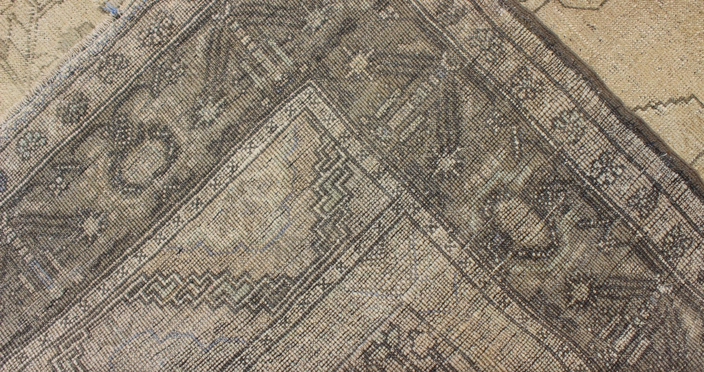 Antique Turkish Oushak with Stylized Medallion Design in Muted Neutral Tones This beautifully muted antique Turkish Oushak displays a stretched central medallion filled with Sub - geometric floral motifs and capped with palmettes. The saw - toothed ... - Keivan Woven ArtsNA - 54726 - 1582Rug