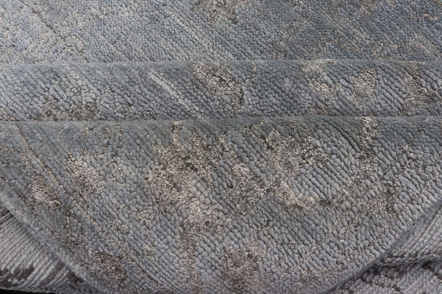 Modern Hand - Knotted Rug in Wool with Floral Design in Blue and Gray This modern Indian rug has been hand - knotted in wool and features an all - over, sub - geometric floral design rendered in blue and gray tones. A complementary, multi - tiered border ... - Keivan Woven ArtsOB - 105860644 - 17346Rug
