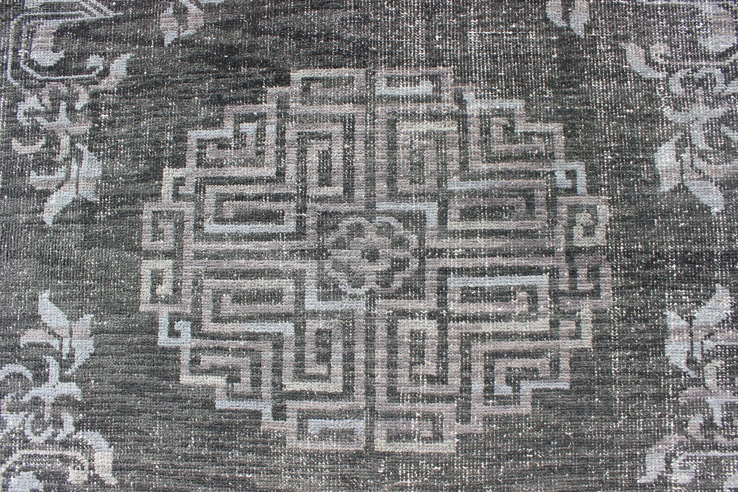 Keivan Woven Arts Modern Khotan Hand Knotted Wool Rug in Charcoal & Gray. This modern Khotan rug has been hand - knotted features an all - over, sub - geometric late central medallion design rendered in charcoal and gray tones. A complementary border encompa... - Keivan Woven ArtsOB - 9444206 - 56230109 - 9308Rug