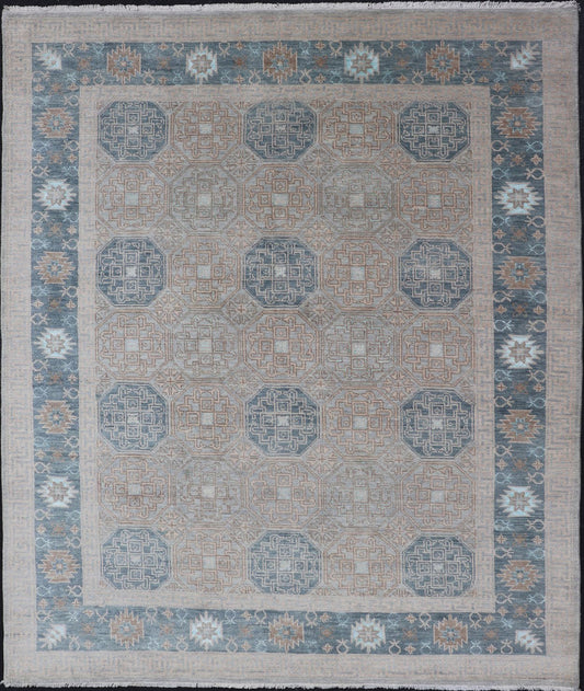 Modern Hand Knotted Khotan in Wool with All - Over Medallion Design in Blue and Earthy Tones This modern Indian Khotan rug has been hand - knotted in wool and features an all - over, sub - geometric medallion design rendered in blue and earthy tones. A ... - Keivan Woven ArtsOB - 9538562 - 98000069 - 15490Rug