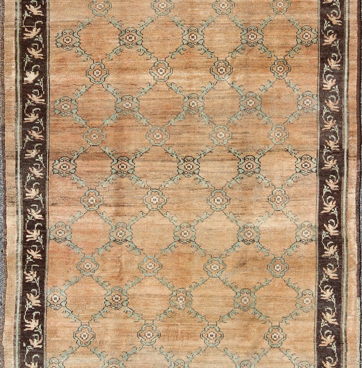 Gallery Turkish Oushak Rug This magnificent Oushak beautifully illustrates the impressive craftsmanship and design of Turkish weavers. The muted design of repeating flowers in light green on a orange background flows through the rug's center fie... - Keivan Woven ArtsOSM - 16 - 4510Rug