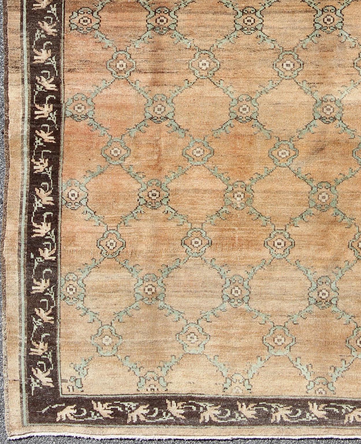 Gallery Turkish Oushak Rug This magnificent Oushak beautifully illustrates the impressive craftsmanship and design of Turkish weavers. The muted design of repeating flowers in light green on a orange background flows through the rug's center fie... - Keivan Woven ArtsOSM - 16 - 4510Rug