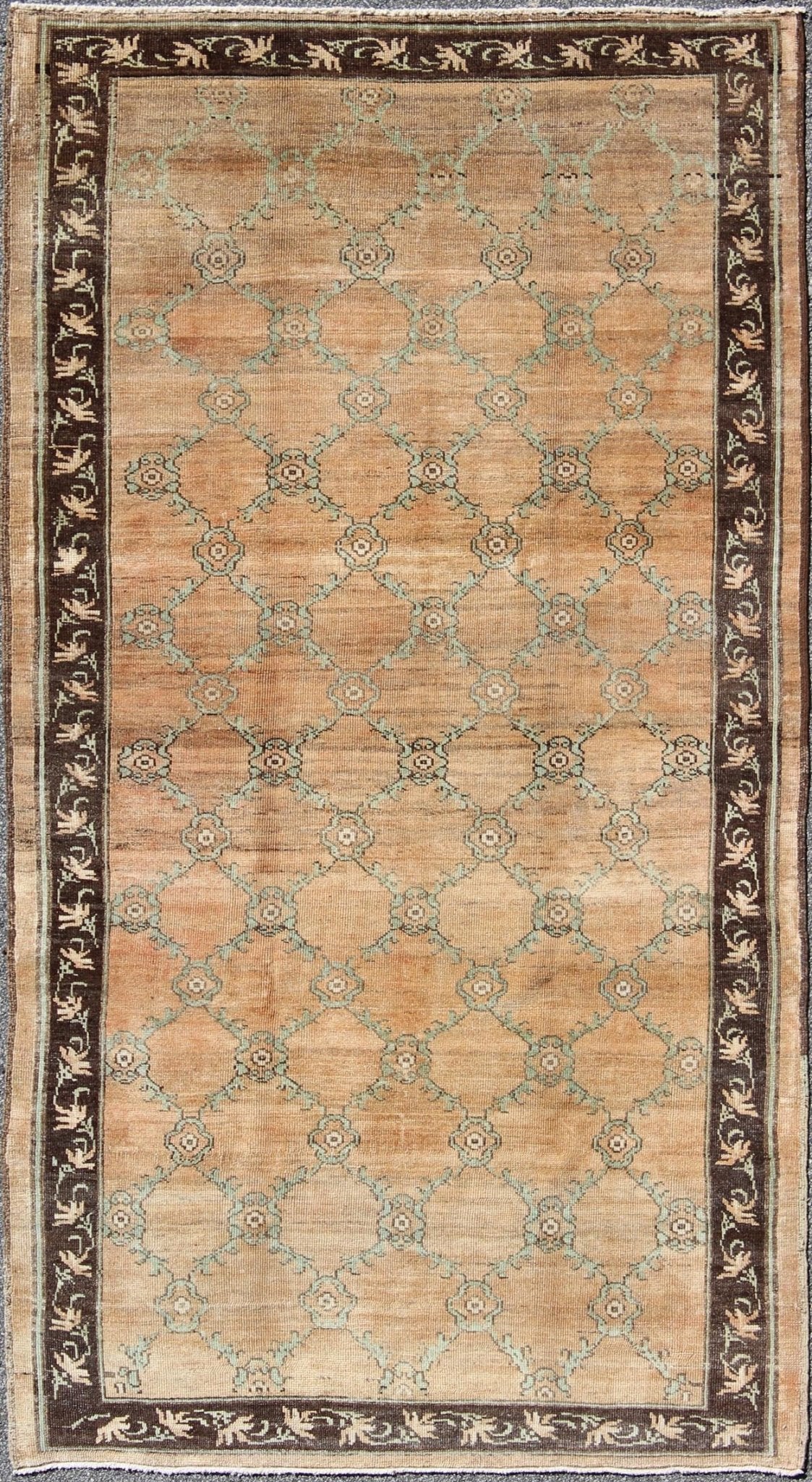 Gallery Turkish Oushak Rug This magnificent Oushak beautifully illustrates the impressive craftsmanship and design of Turkish weavers. The muted design of repeating flowers in light green on a orange background flows through the rug's center fie... - Keivan Woven ArtsOSM - 16 - 4510Rug