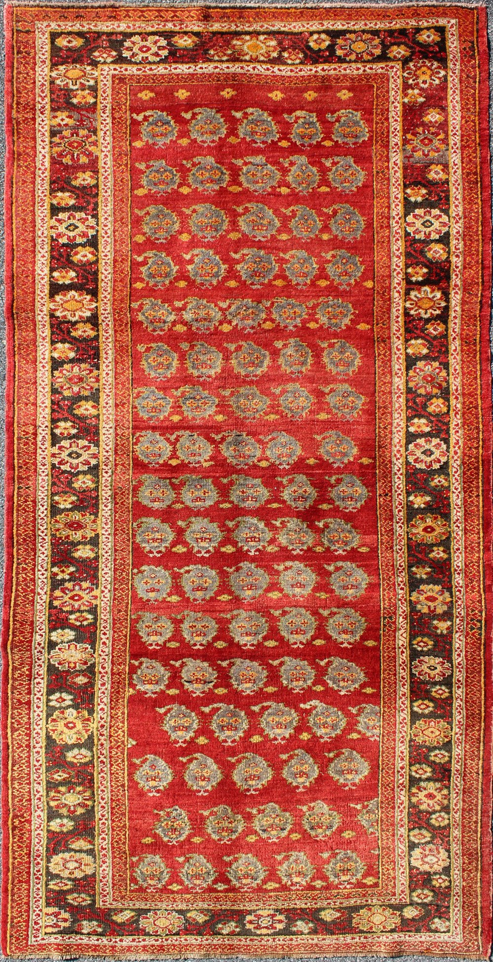 Red Turkish Oushak Carpet with All - Over Paisley Design and Central Red Field This unique Turkish Oushak carpet features an all - over design of intricate paisley shapes set atop a central field of bright red. The entire piece is encompassed by a f... - Keivan Woven ArtsOSM - 23 - 4518Rug