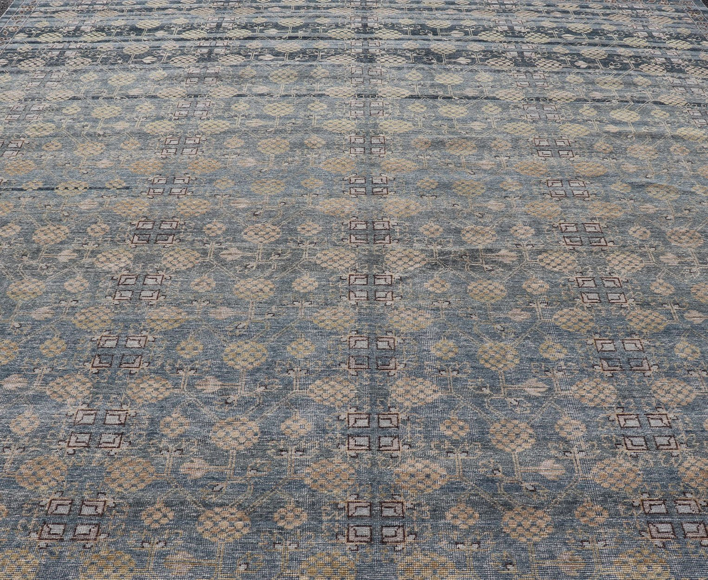 Modern All - Over Tribal Motif Khotan Area Rug in Dark Blues, Brown and Cream. Country of Origin: Afghanistan; Type: Khotan; Design: Floral, All - Over; Keivan Woven Arts: rug/PUR - 42561. Measures: 12'1 x 15'1 This modern Khotan features a modern da... - Keivan Woven ArtsPUR - 42561 - GS - 1016 - 22620Rug