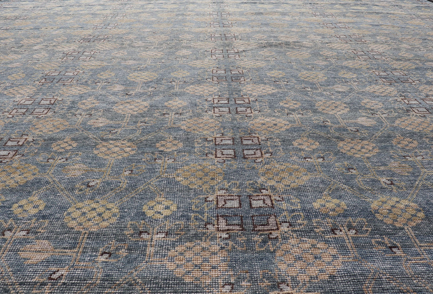 Modern All - Over Tribal Motif Khotan Area Rug in Dark Blues, Brown and Cream. Country of Origin: Afghanistan; Type: Khotan; Design: Floral, All - Over; Keivan Woven Arts: rug/PUR - 42561. Measures: 12'1 x 15'1 This modern Khotan features a modern da... - Keivan Woven ArtsPUR - 42561 - GS - 1016 - 22620Rug