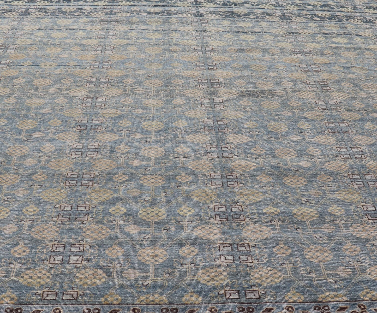 Modern All - Over Tribal Motif Khotan Area Rug in Dark Blues, Brown and Cream. Country of Origin: Afghanistan; Type: Khotan; Design: Floral, All - Over; Keivan Woven Arts: rug/PUR - 42561. Measures: 12'1 x 15'1 This modern Khotan features a modern da... - Keivan Woven ArtsPUR - 42561 - GS - 1016 - 22620Rug