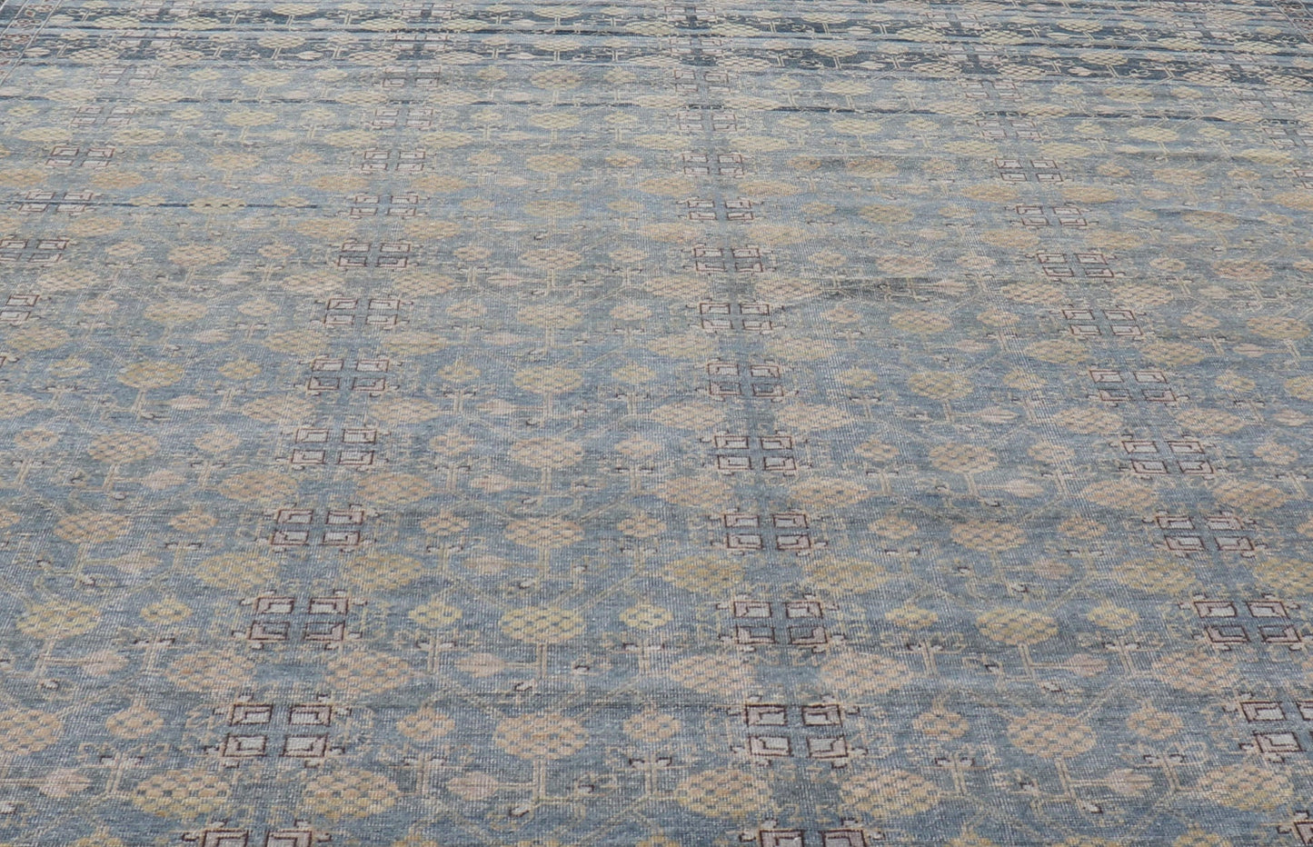 Modern All - Over Tribal Motif Khotan Area Rug in Dark Blues, Brown and Cream. Country of Origin: Afghanistan; Type: Khotan; Design: Floral, All - Over; Keivan Woven Arts: rug/PUR - 42561. Measures: 12'1 x 15'1 This modern Khotan features a modern da... - Keivan Woven ArtsPUR - 42561 - GS - 1016 - 22620Rug