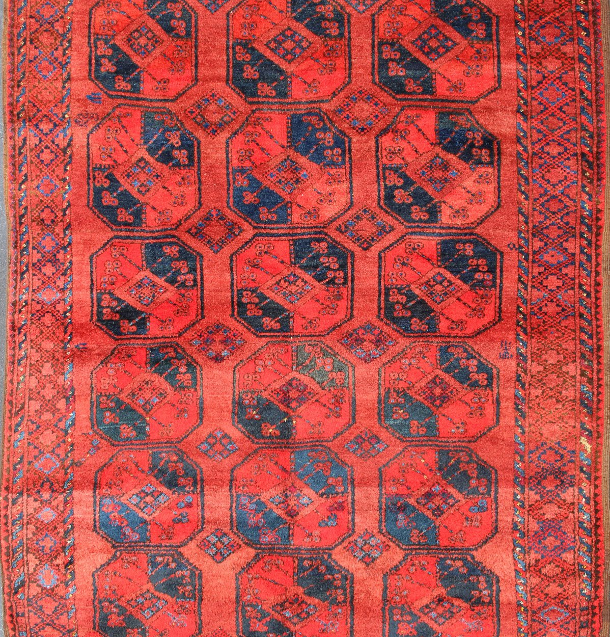 Ersari rug Medium sized hand - knotted rug with a red background with navy blue accents, cased within an intricate border and Gul design within the field. Circa 1940, Turkomen sub geometric, Keivan Woven Arts, rug R20 - 0604 Measurement 7'3... - Keivan Woven ArtsR20 - 0604 - 12946Rug